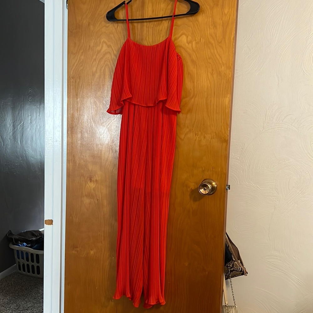 Bright red jumpsuit. Wore once. Size small. Excellent condition.